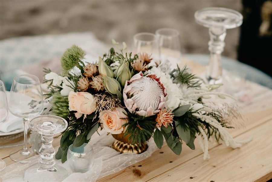 KAIROS, EL ARTE DE BUSCAR EL MOMENTO ADECUADO centro-mesa-boda 